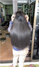Load image into Gallery viewer, Human hair extension, 60 centimeters long (reaches below the waist when attached). Weight approximately 210 grams.