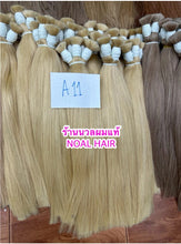 Load image into Gallery viewer, Human hair extension, 60 centimeters long (reaches below the waist when attached). Weight approximately 210 grams.